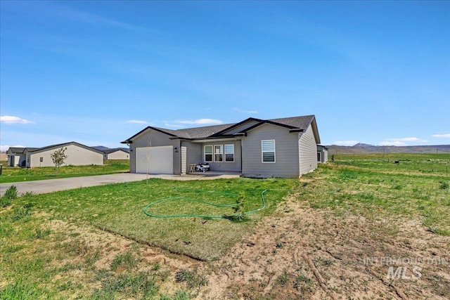 190 Bison Way, Fairfield, ID 83327 - ranch-style home with driveway, a garage, and a front lawn