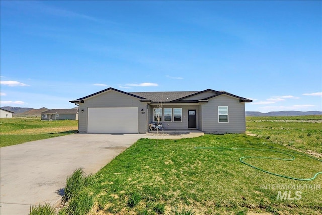 190 Bison Way, Fairfield, ID 83327 - single story home with an attached garage, driveway, and a front lawn