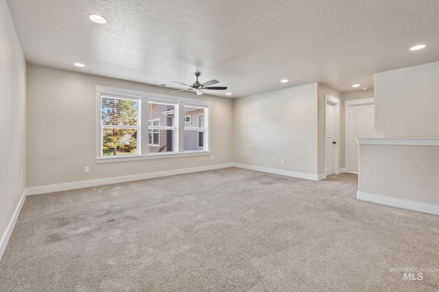 74 E Ranch Dr, Eagle, ID 83616 - unfurnished room with light carpet, ceiling fan, recessed lighting, and a textured ceiling