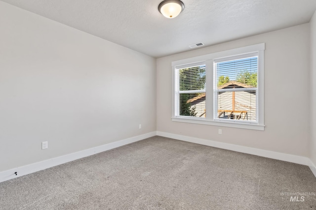 74 E Ranch Dr, Eagle, ID 83616 - carpeted spare room featuring baseboards and a textured ceiling