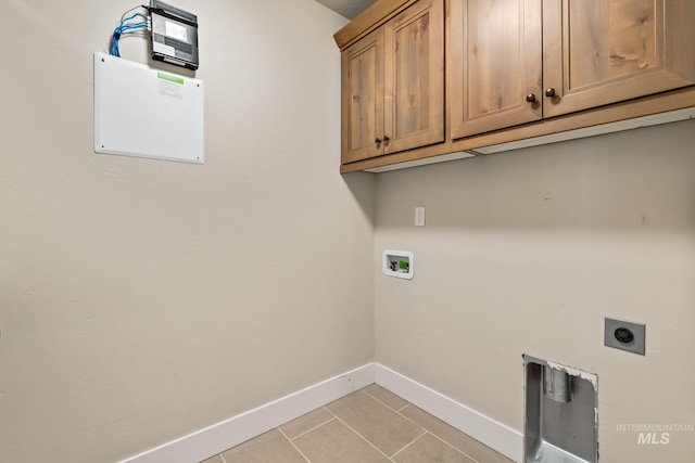 74 E Ranch Dr, Eagle, ID 83616 - washroom with cabinet space, hookup for a washing machine, light tile patterned flooring, and electric dryer hookup