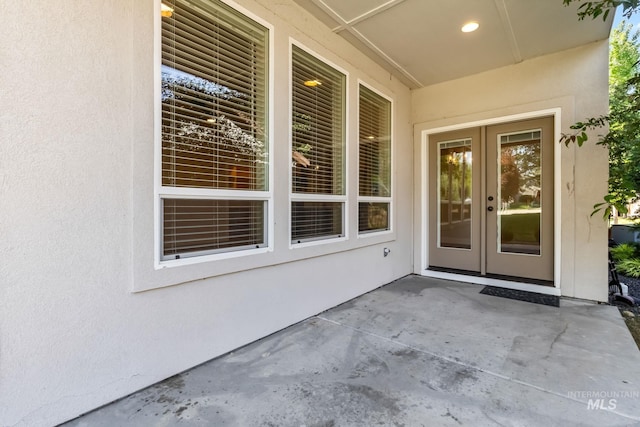 74 E Ranch Dr, Eagle, ID 83616 - property entrance featuring stucco siding, french doors, and a patio