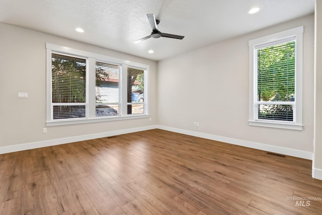 74 E Ranch Dr, Eagle, ID 83616 - unfurnished room featuring ceiling fan, wood finished floors, and recessed lighting