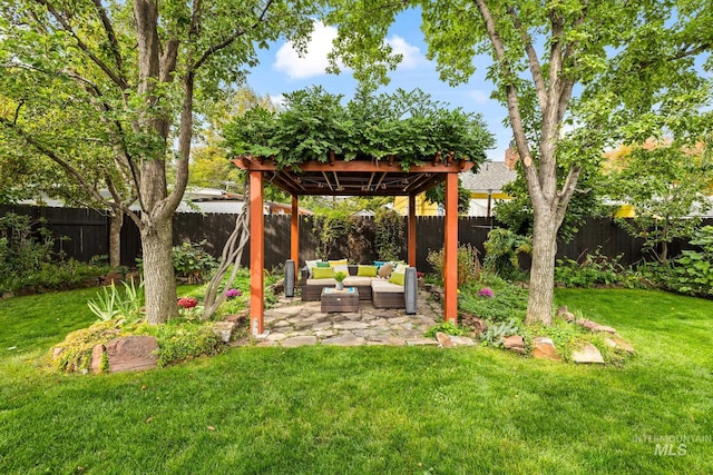 view of yard featuring an outdoor living space and a patio area