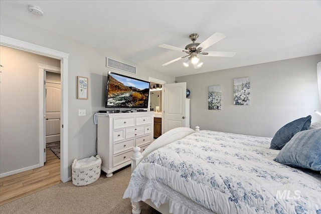 1440 Riverbend Pl, Twin Falls, ID 83301 - bedroom with a ceiling fan, light wood-style flooring, and light colored carpet