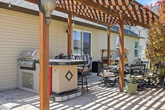 1440 Riverbend Pl, Twin Falls, ID 83301 - view of patio with a pergola, an outdoor bar, an outdoor kitchen, and outdoor dining space