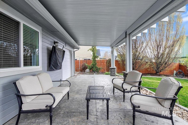 view of patio featuring outdoor lounge area and a fenced backyard