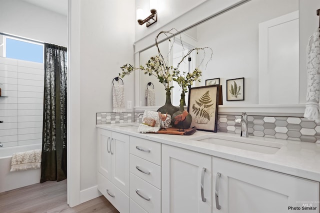 3053 Ajax Ave, Eagle, ID 83616 - bathroom with backsplash, wood finished floors, double vanity, and shower / bath combination with curtain