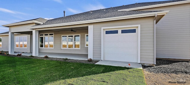 3053 Ajax Ave, Eagle, ID 83616 - property entrance with a lawn, a garage, ceiling fan, and roof with shingles