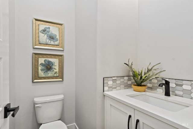 3053 Ajax Ave, Eagle, ID 83616 - bathroom featuring toilet, tasteful backsplash, and vanity