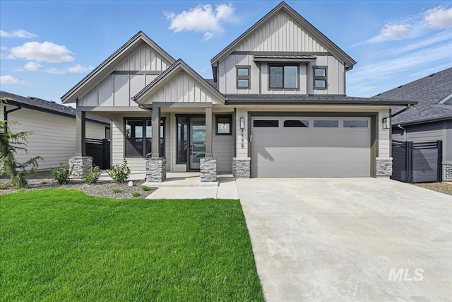 7779 W Daybreak Run Ct, Meridian, ID 83646 - view of front facade with board and batten siding, driveway, a front lawn, and covered porch