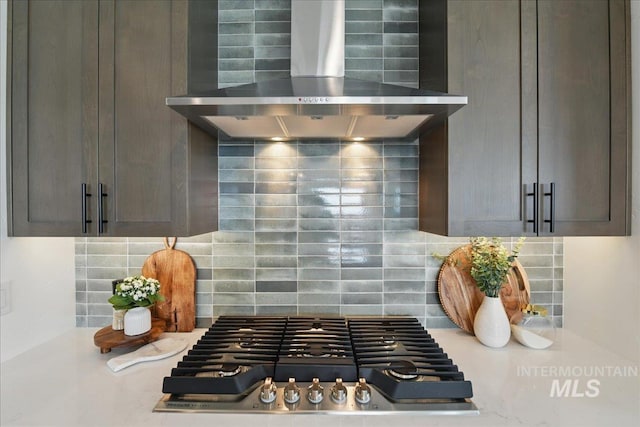 7779 W Daybreak Run Ct, Meridian, ID 83646 - kitchen view of wall chimney range hood, tasteful backsplash, light countertops, and stainless steel gas stovetop