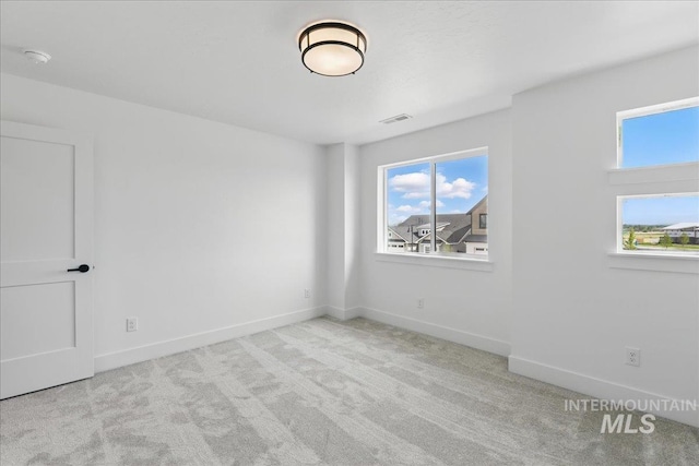 7779 W Daybreak Run Ct, Meridian, ID 83646 - carpeted empty room with healthy amount of natural light and baseboards