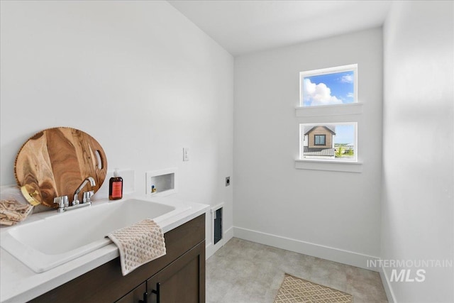7779 W Daybreak Run Ct, Meridian, ID 83646 - clothes washing area with cabinet space, hookup for an electric dryer, washer hookup, and baseboards