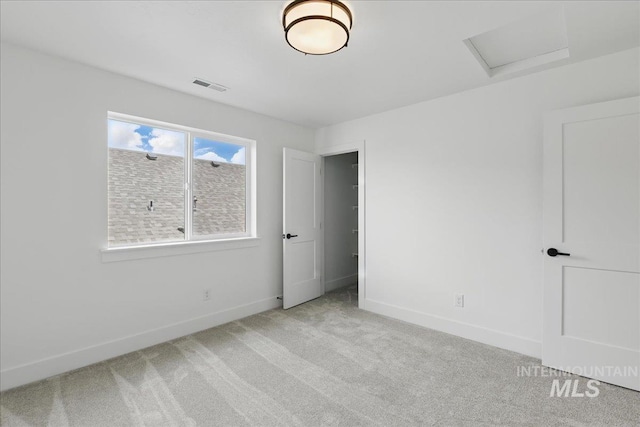 7779 W Daybreak Run Ct, Meridian, ID 83646 - unfurnished bedroom with attic access, carpet floors, and baseboards