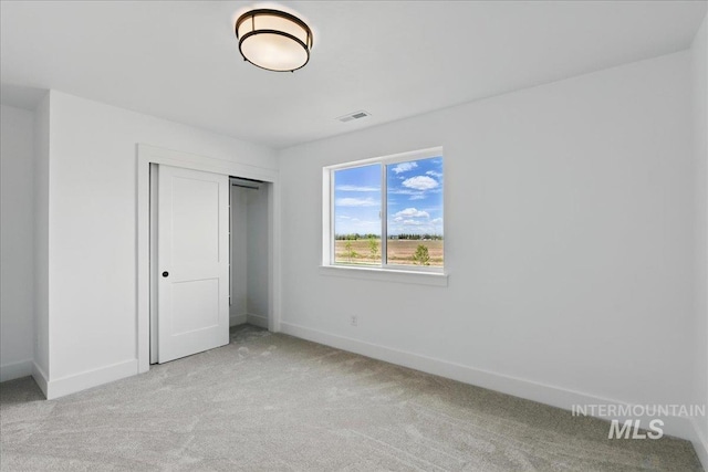 7779 W Daybreak Run Ct, Meridian, ID 83646 - unfurnished bedroom featuring light colored carpet, baseboards, and a closet