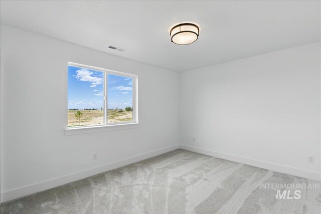 7779 W Daybreak Run Ct, Meridian, ID 83646 - empty room featuring light colored carpet and baseboards