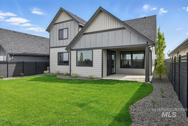 7779 W Daybreak Run Ct, Meridian, ID 83646 - back of house with board and batten siding, a patio, and a shingled roof