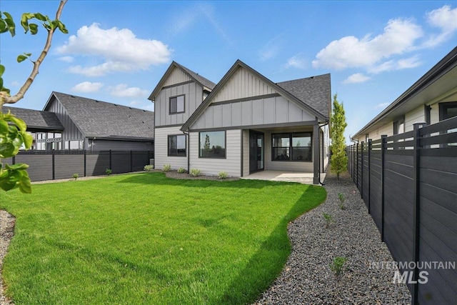 7779 W Daybreak Run Ct, Meridian, ID 83646 - rear view of house featuring board and batten siding and a patio