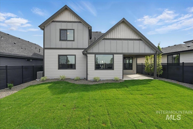 7779 W Daybreak Run Ct, Meridian, ID 83646 - back of property with board and batten siding and a patio area