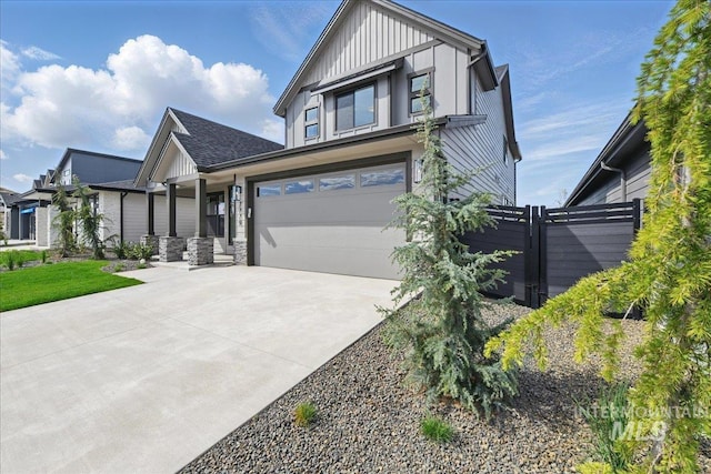7779 W Daybreak Run Ct, Meridian, ID 83646 - view of front of property featuring board and batten siding, concrete driveway, an attached garage, and fence