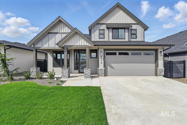 7779 W Daybreak Run Ct, Meridian, ID 83646 - view of front of property featuring board and batten siding, concrete driveway, a front yard, an attached garage, and stone siding