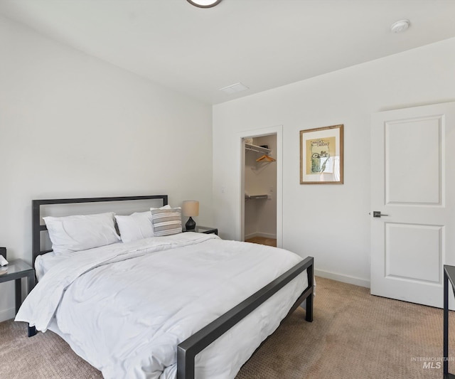 1681 W Idaho St, Boise, ID 83702 - bedroom featuring baseboards, a spacious closet, a closet, and light colored carpet