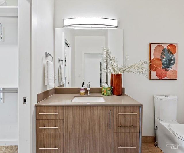 1681 W Idaho St, Boise, ID 83702 - bathroom featuring toilet, vanity, and baseboards