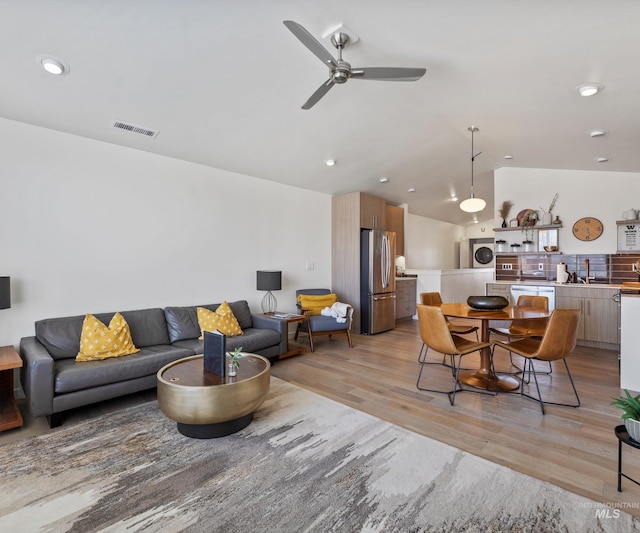 1681 W Idaho St, Boise, ID 83702 - living area featuring recessed lighting, vaulted ceiling, visible vents, light wood-style flooring, and ceiling fan