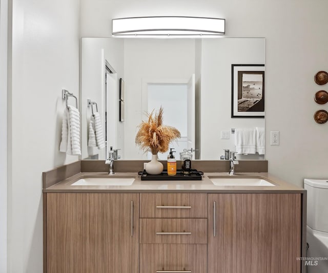 1681 W Idaho St, Boise, ID 83702 - bathroom with a sink, double vanity, and toilet
