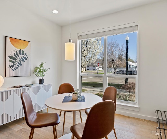 1681 W Idaho St, Boise, ID 83702 - dining area featuring radiator, light wood-type flooring, and baseboards