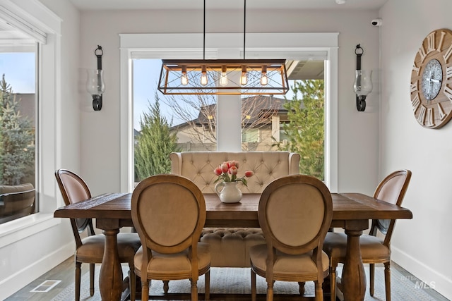 486 E Andes Dr, Kuna, ID 83634 - dining area featuring a wealth of natural light, baseboards, and wood finished floors