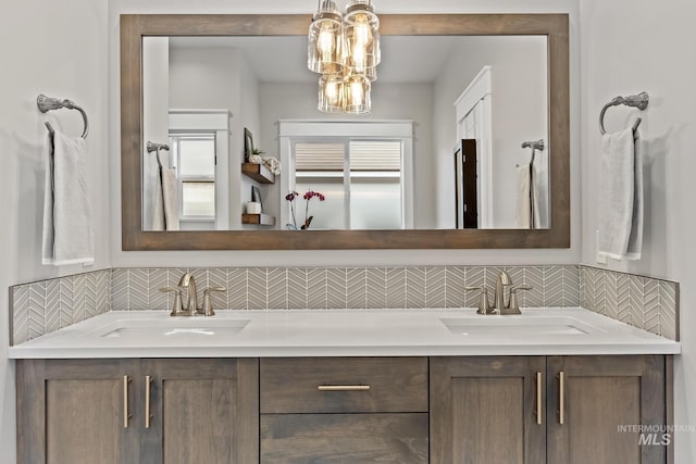 486 E Andes Dr, Kuna, ID 83634 - bathroom with a sink, backsplash, and double vanity