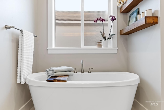 486 E Andes Dr, Kuna, ID 83634 - full bath with a freestanding bath and baseboards