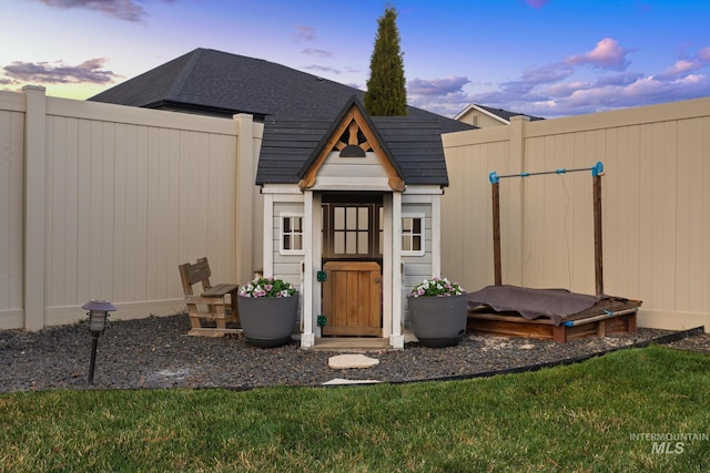 486 E Andes Dr, Kuna, ID 83634 - outdoor structure at dusk featuring a yard and fence