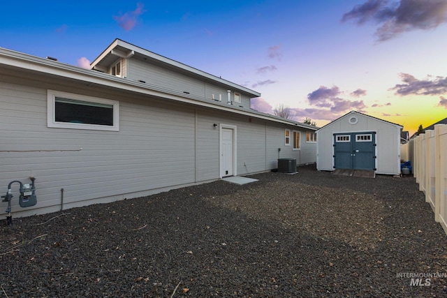 486 E Andes Dr, Kuna, ID 83634 - back of property with a fenced backyard, an outdoor structure, cooling unit, and a storage unit