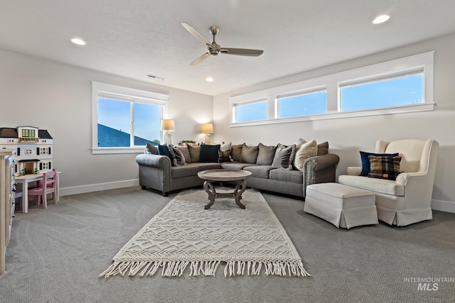 486 E Andes Dr, Kuna, ID 83634 - carpeted living room with baseboards, a ceiling fan, and recessed lighting