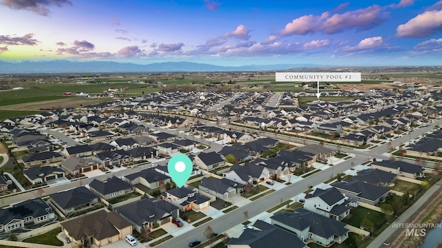 486 E Andes Dr, Kuna, ID 83634 - aerial view at dusk featuring a mountain view and a residential view