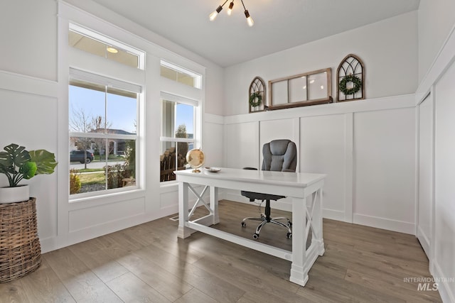 486 E Andes Dr, Kuna, ID 83634 - office area with a decorative wall, a wainscoted wall, and wood finished floors