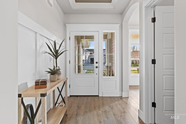 486 E Andes Dr, Kuna, ID 83634 - doorway to outside featuring arched walkways and wood finished floors