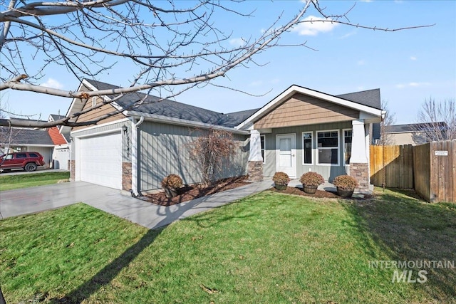 ranch-style house featuring a front yard and a garage