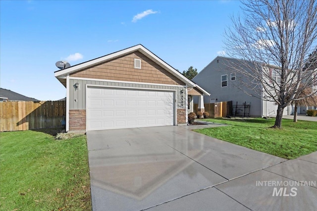 view of front of house featuring a garage and a front lawn