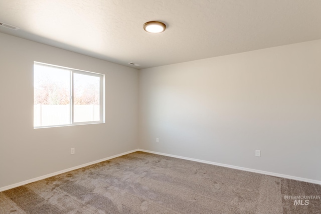 310 Chalcedony Ave, Caldwell, ID 83605 - spare room featuring carpet, baseboards, and visible vents