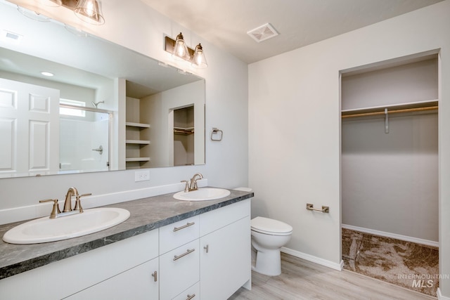 310 Chalcedony Ave, Caldwell, ID 83605 - bathroom with visible vents, a sink, and a shower stall