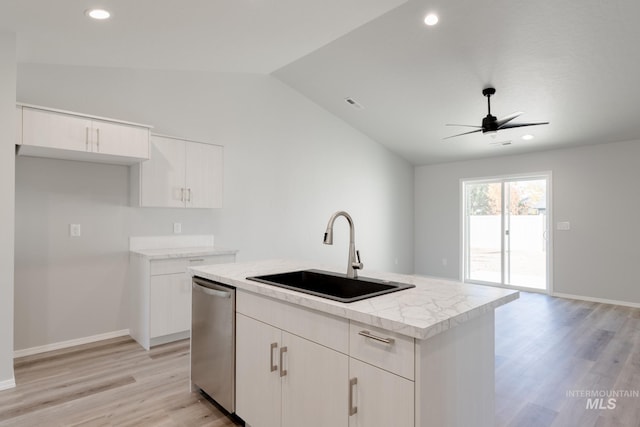 310 Chalcedony Ave, Caldwell, ID 83605 - kitchen with vaulted ceiling, light wood-type flooring, stainless steel dishwasher, a sink, and a kitchen island with sink