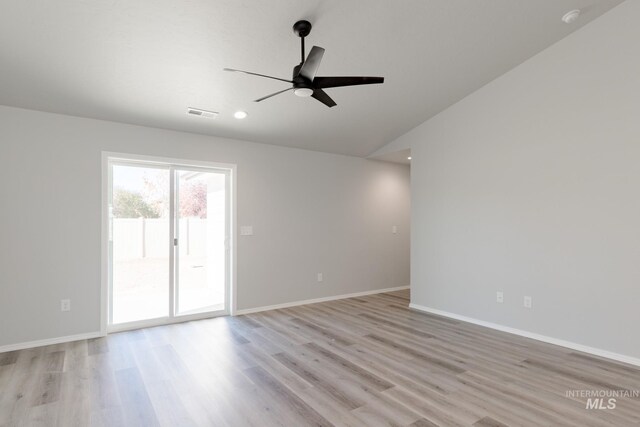 310 Chalcedony Ave, Caldwell, ID 83605 - spare room with baseboards, ceiling fan, recessed lighting, lofted ceiling, and light wood-type flooring