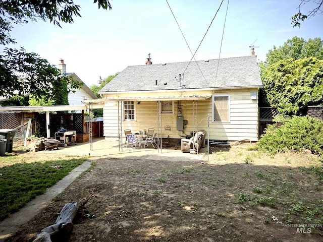 1025 9th St, Clarkston, WA 99403 - rear view of house with a patio and a chimney