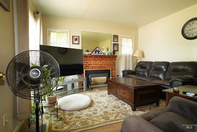 1025 9th St, Clarkston, WA 99403 - living room with plenty of natural light, wood finished floors, and a fireplace