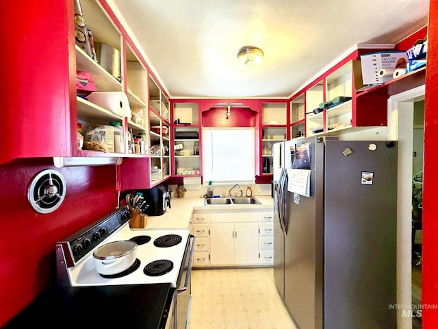 1025 9th St, Clarkston, WA 99403 - kitchen with open shelves, electric range, stainless steel fridge with ice dispenser, and light flooring