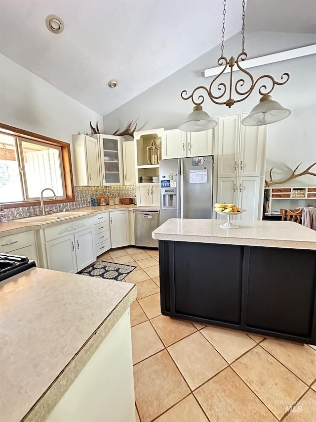 kitchen with open shelves, stainless steel appliances, light countertops, light tile patterned floors, and lofted ceiling